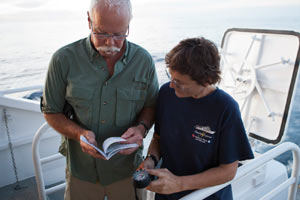 Crew helping out guests on the Nautilus Explorer